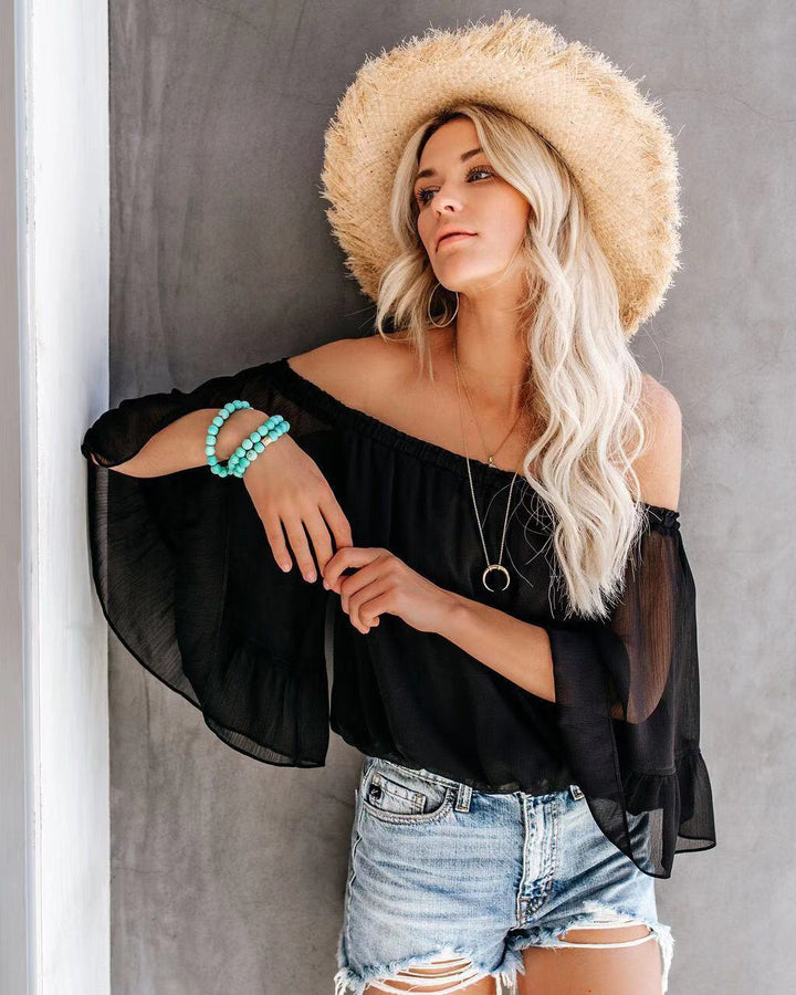 Kvinders bluse med bred ærme og off-shoulder design Skovae
