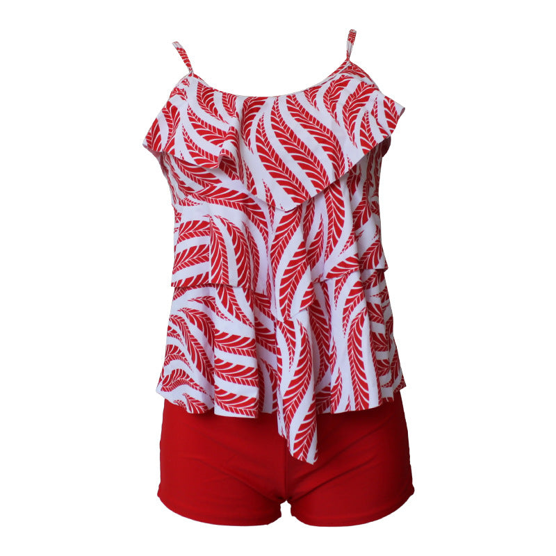 Dame badedragt med voluminøst flæsedesign og shorts Stilla