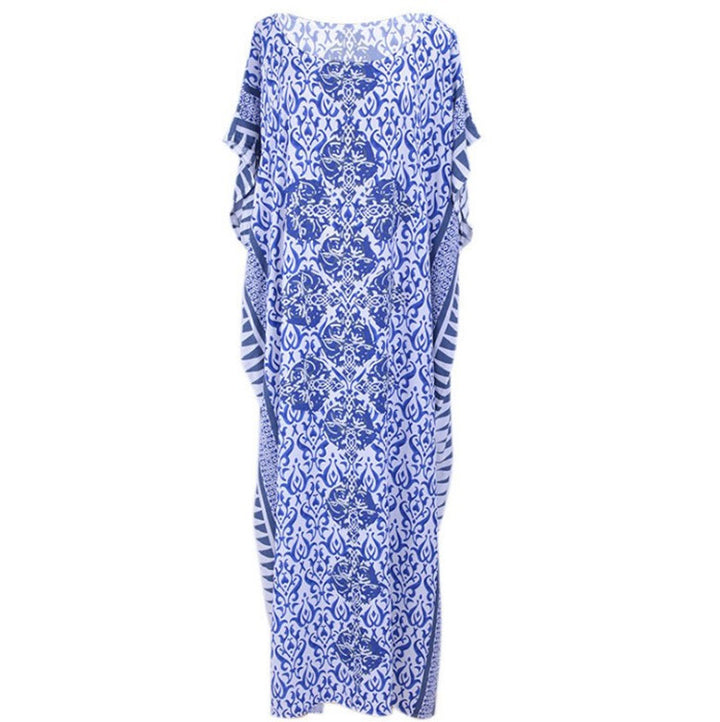 Dame Maxi-strandkjole med stilfuldt floralt design og luftig silhuet Stilla