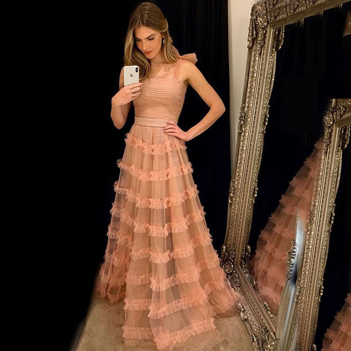 Dame maxikjole med voluminøse flæseskaber og strapless design Stilla