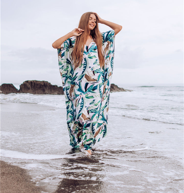 Dame strandkaftan med blomstermotiv og luftig pasform Stilla