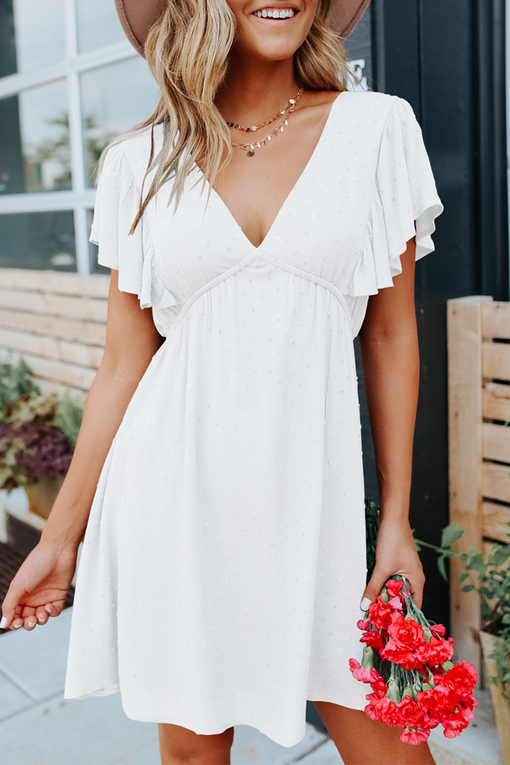 Stilla | V-hals Kjole med Flounce og Kage Nederdele Look