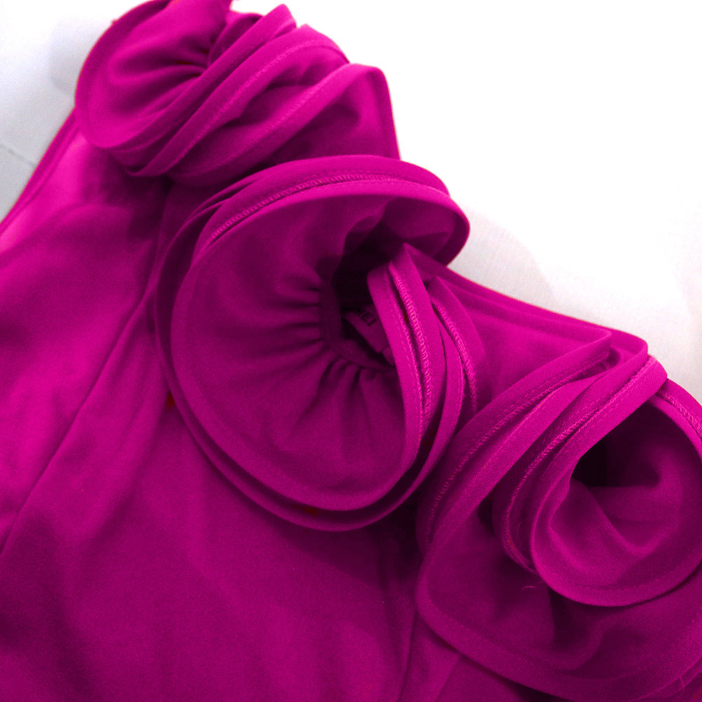 Dame elegant jumpsuit med asymmetrisk snit og voluminøse flæse detaljer Skovae