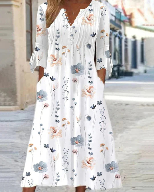 Skovae | Modetrend Midikjole i bomuldsblanding med blomsterprint, lommer og 3/4-ærmer