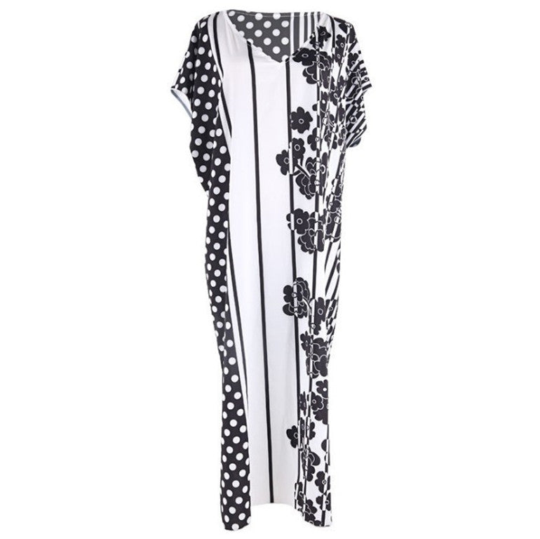 Dame Strandkjole i moderne patchwork-design med floral accent Stilla