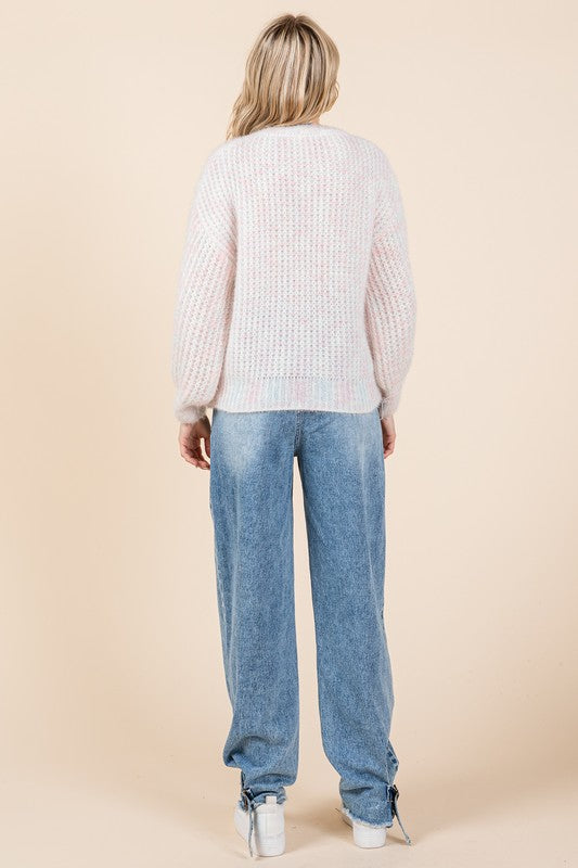 Stilla | Pullover af groft strik med broderet knude
