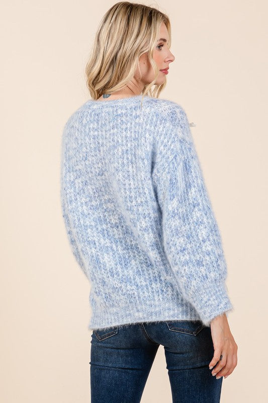 Stilla | Pullover af groft strik med broderet knude