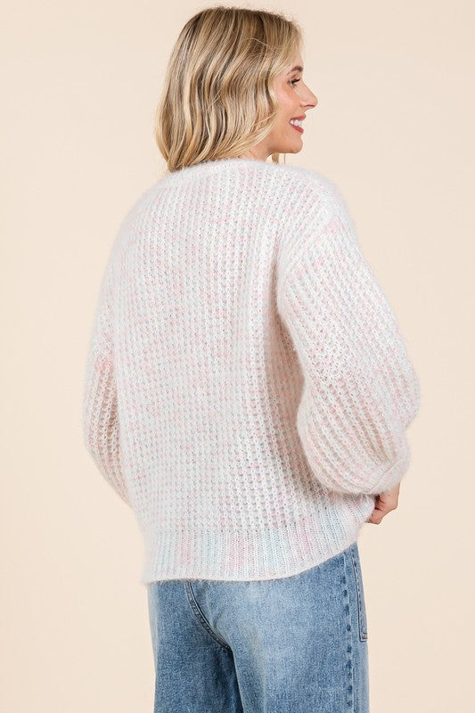 Stilla | Pullover af groft strik med broderet knude