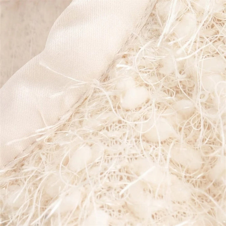 Stilla | Textureret Boucle Kappe Med Sløjfedetalje