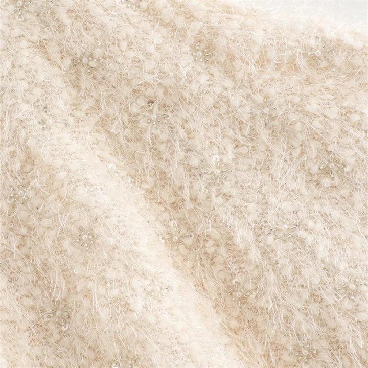 Stilla | Textureret Boucle Kappe Med Sløjfedetalje