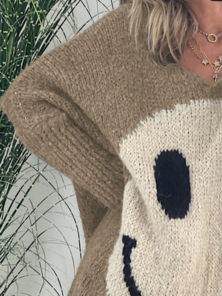 Stilla | Pullover med lange ærmer med et smilende ansigt og V-udskæring