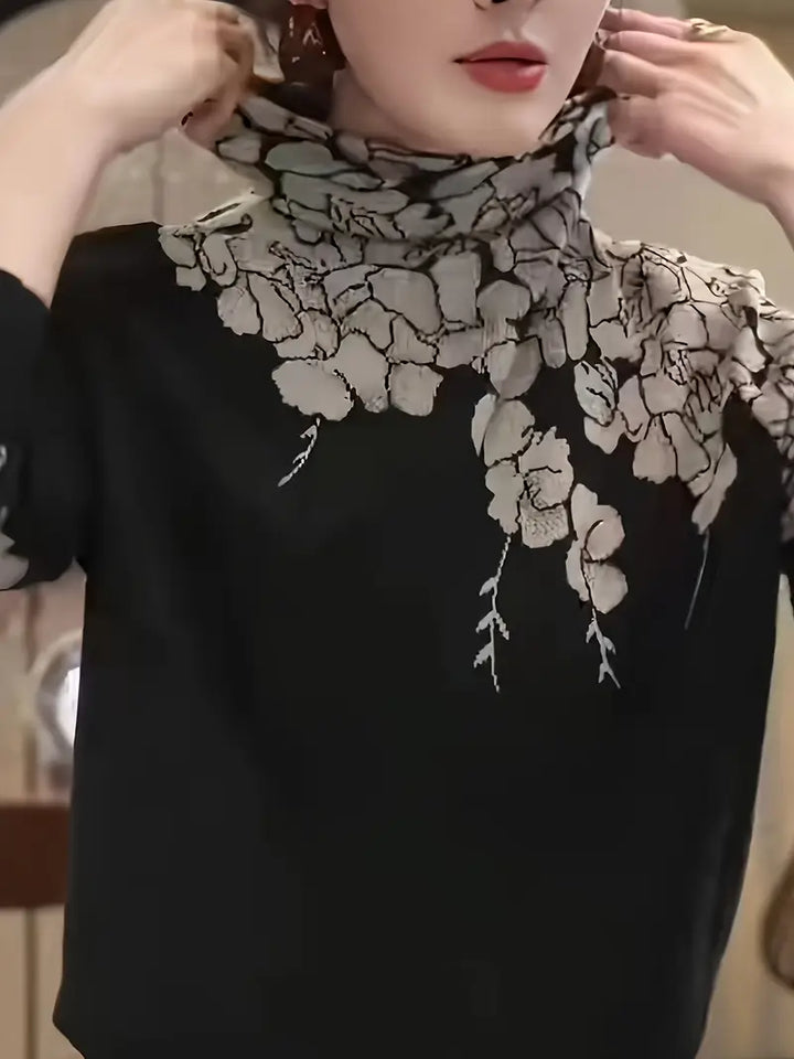 Stilla | Elegant strikpullover med rullekrave og blomstertryk