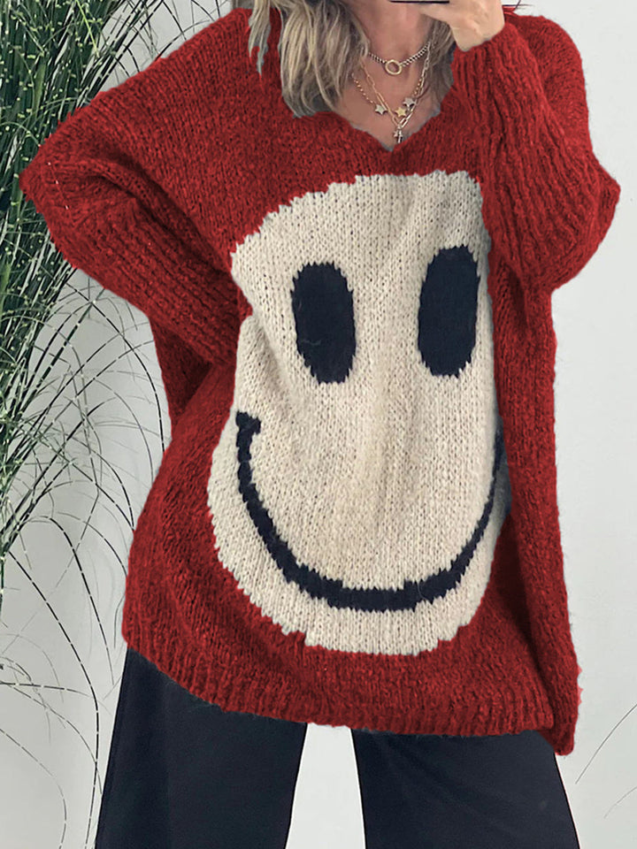 Stilla | Pullover med lange ærmer med et smilende ansigt og V-udskæring