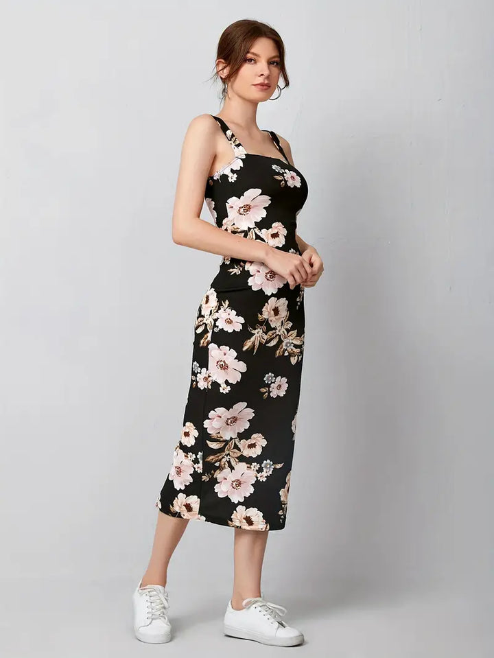 Stilla | Sort Midi Kjole Med Blomsterprint Elegant Ærmeløs Sommerkjole Med Høj Slids