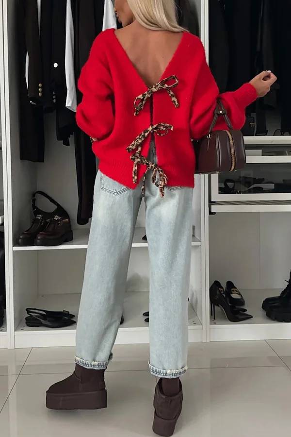 Stilla | Strikpullover med trendy kvaster, leopardmønster og bindebånd