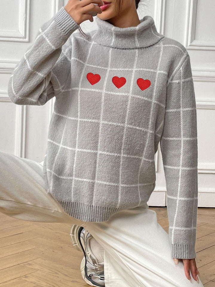 Stilla | Pullover med høj hals og lange ærmer med hjerteformet ternet mønster