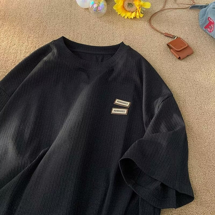 Dame afslappet T-shirt med struktureret stof og moderigtig logo Stilla