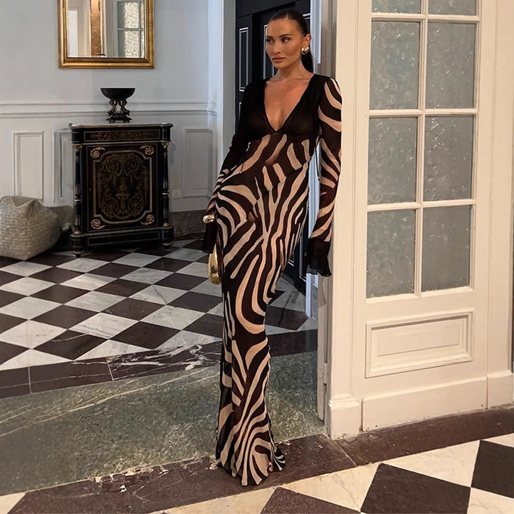 Dame maxikjole med asymmetrisk snit og elegant zebra-design Stilla