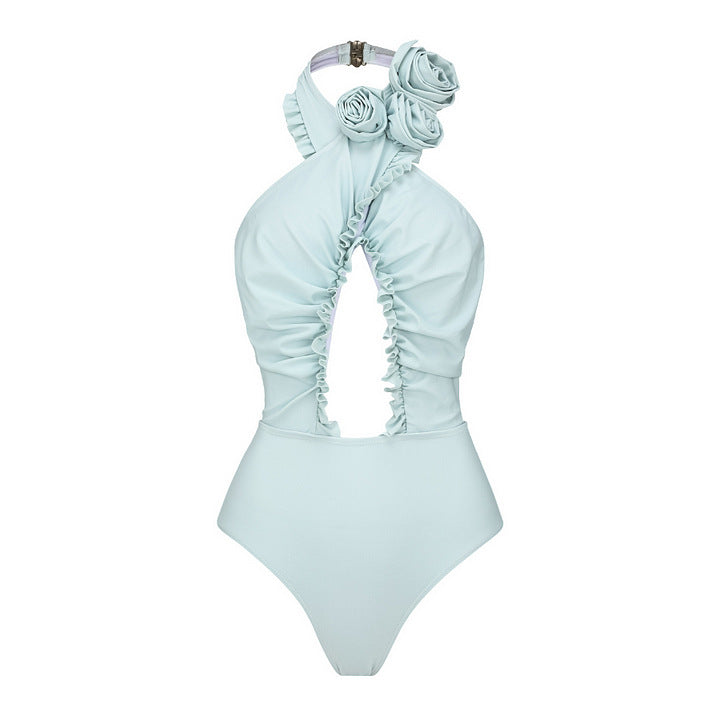 Dame svømmedragt med blomstret design og raffineret cut-out-look Skovae