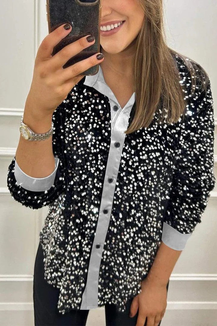 Dame glitrende bluse med elegant knaplukning og luksuriøst design Stiila