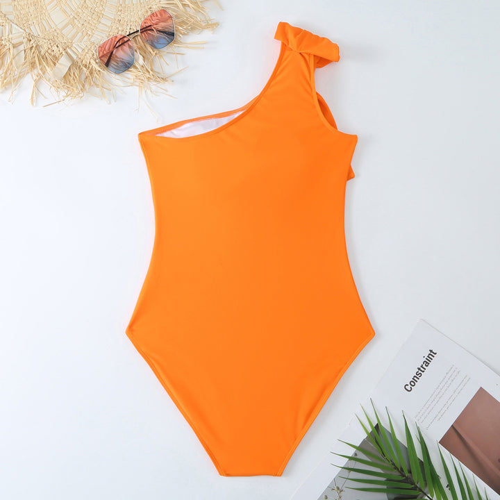 Dame ét delet badedragt med asymmetrisk snit og matchende indpakningsskørt Stilla