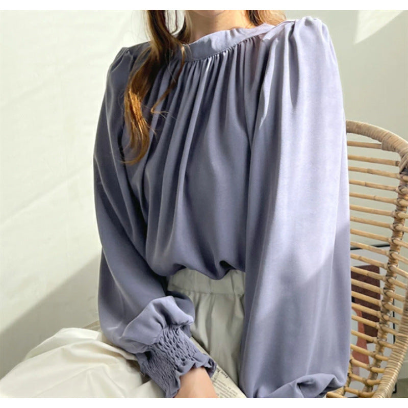 Kvindernes elegante bluse med voluminøse ærmer og opretstående krave Stilla