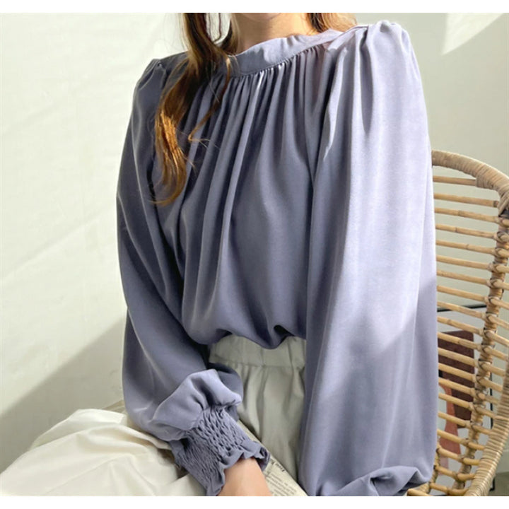 Kvindernes elegante bluse med voluminøse ærmer og opretstående krave Stilla