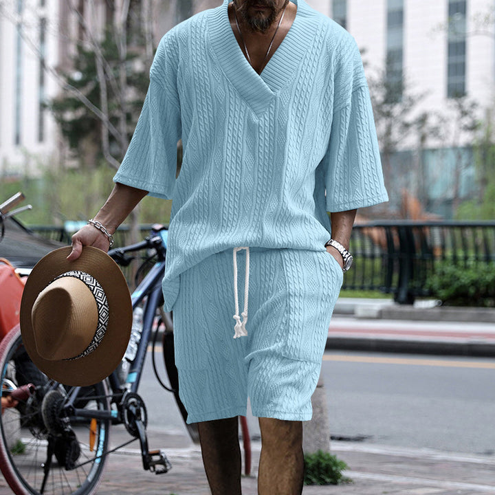 Herrer afslappet kortærmet overdel med struktureret strikdesign og praktiske lommer Stilla