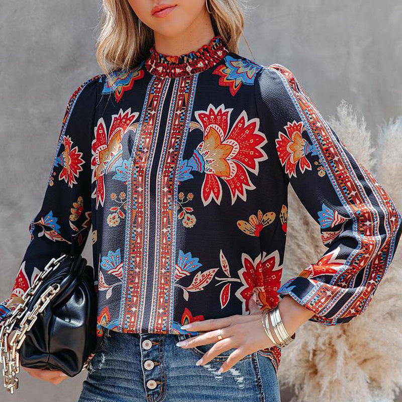 Damer modebluse med puffærmer og blomstret design Stilla
