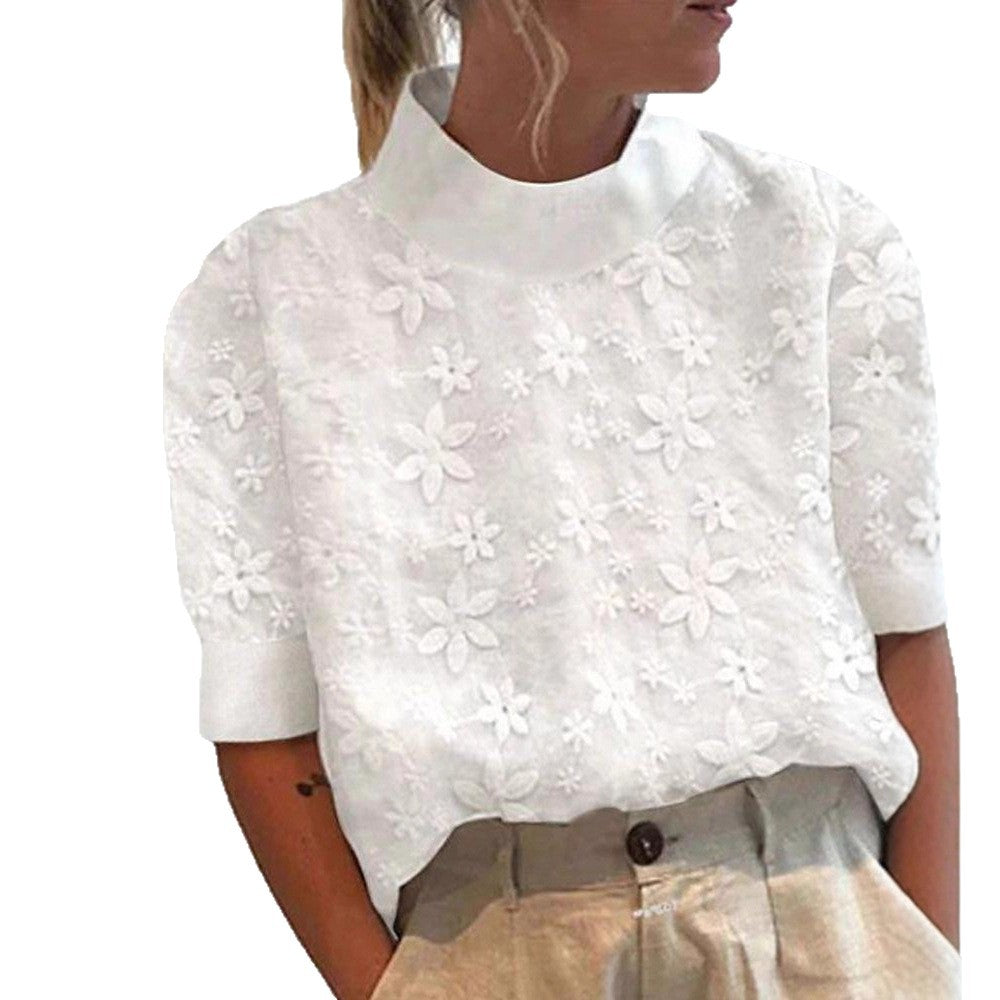 Kvinders bluse med blomsterbroderi design og kort snit Stilla