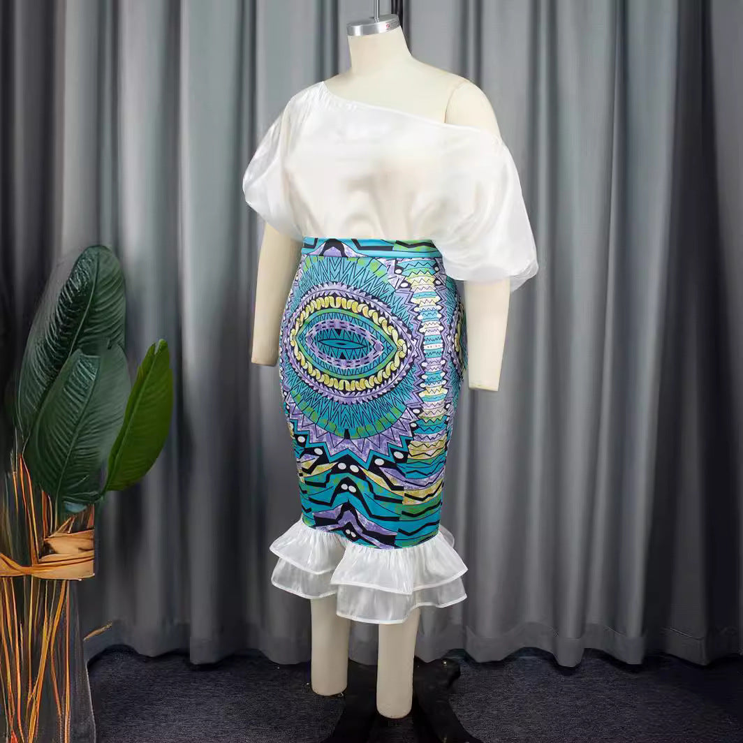 Damer Elegant kjole med asymmetrisk design og farverig print Skovae