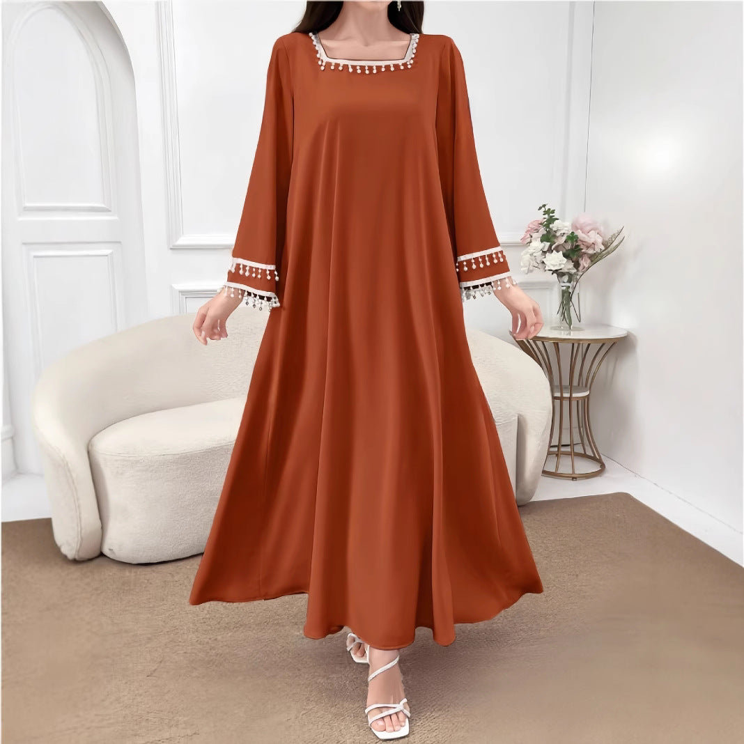 Kvindelige elegante maxi kjoler med dekorative franje og brede ærmer