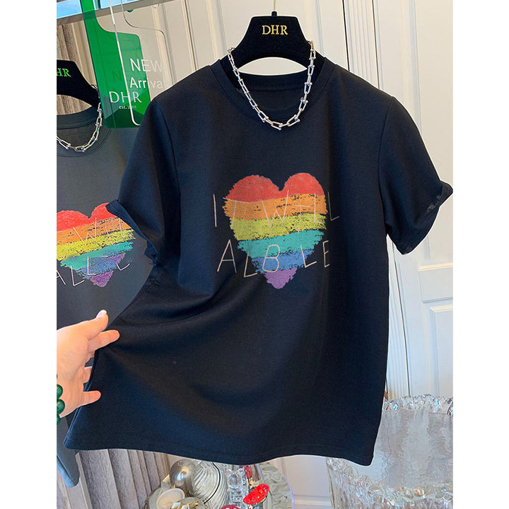 Dame T-shirt med kreativt regnbueskærtsmotiv og inspirerende skrift Stilla