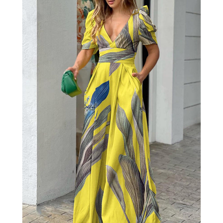 Femme Tropical Print Maxi Kjole med flatterende Vikkel-design Stilla