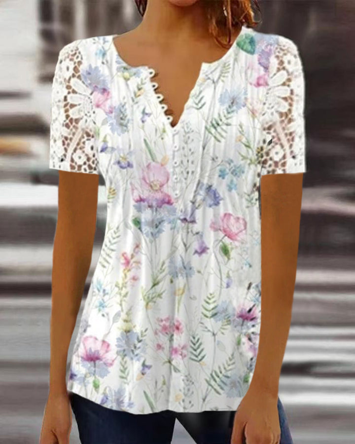 Damebluse med spidse ærmer og blomsterdesign Stilla