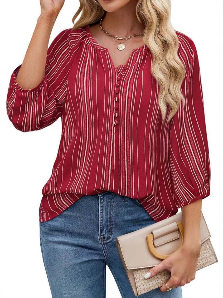 Damebluse med stribet design og elegante knapdetaljer Stilla