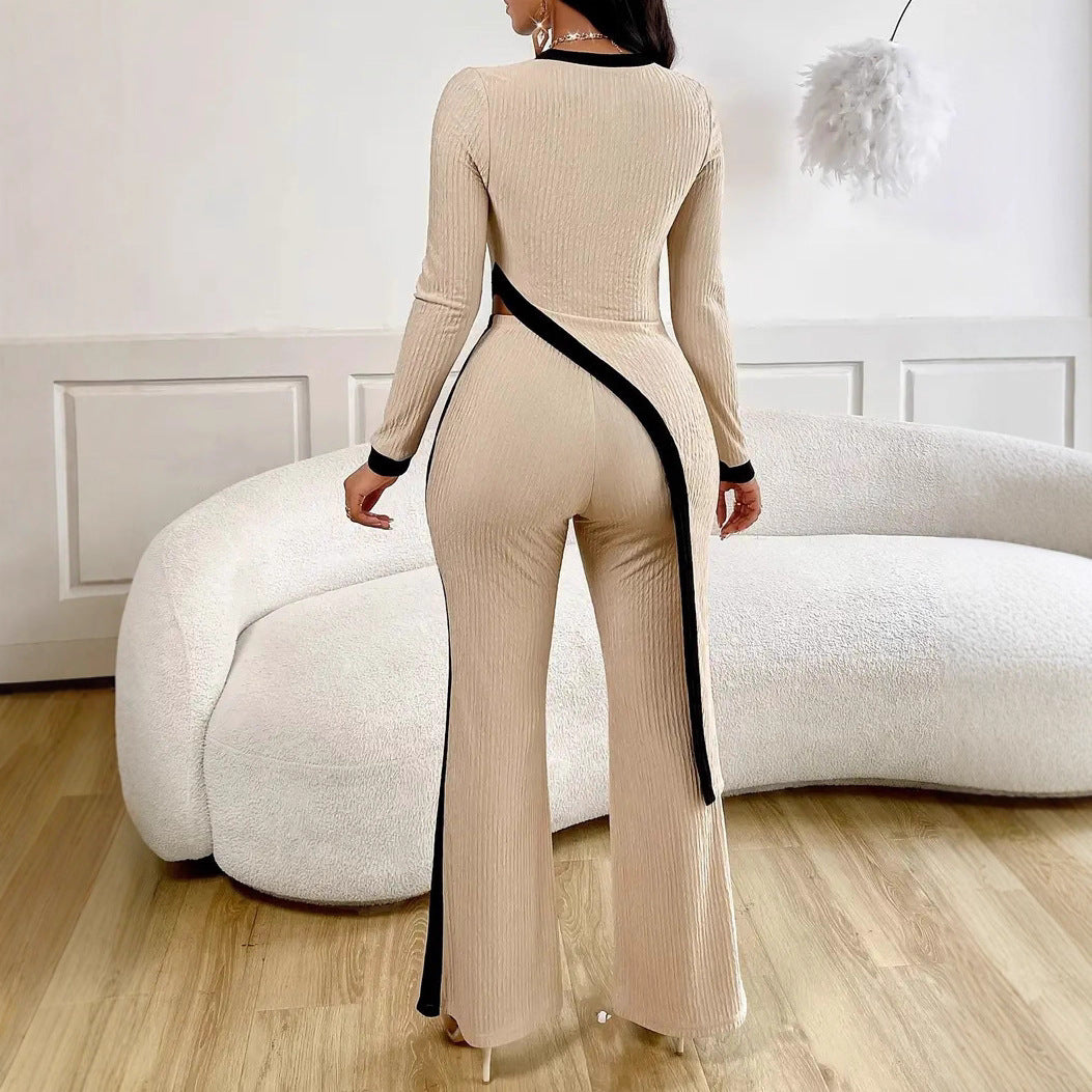 Kvinders stilfulde jumpsuit med asymmetrisk design og kontrasterende piping Stilla