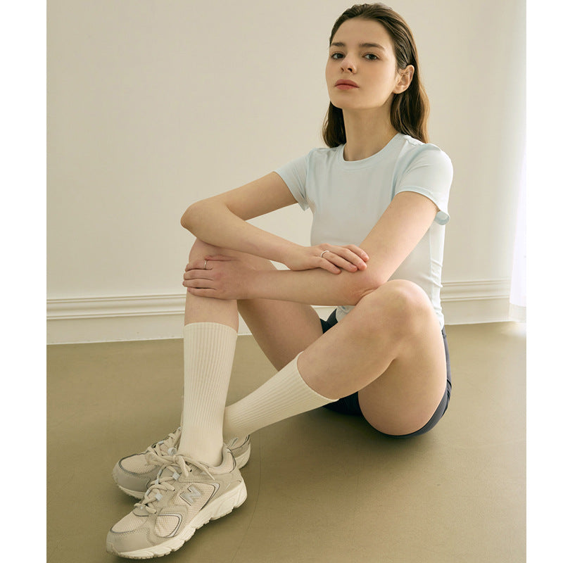 Dame sporty kortærmet T-shirt med asymmetrisk snit og åndbar teknologi Stilla
