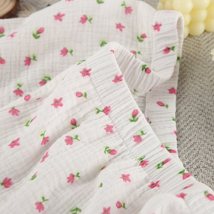 Dame afslappet pyjamasæt med blomsterprint og behagelige knapdetaljer Stilla
