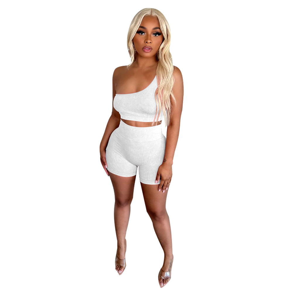 Dame sporty to-delt sæt med asymmetrisk crop-top og høje shorts Stilla