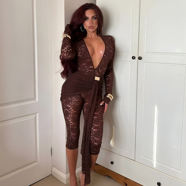 Dame sexet jumpsuit i spids med dyb V-udskæring og taljebælte Stilla
