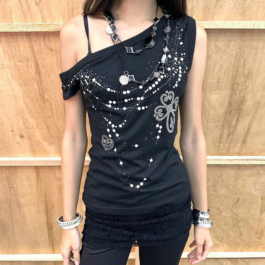 Dame top med off-shoulder design og funklende detaljer Skovae