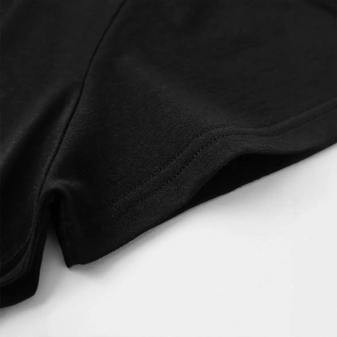 Dame T-shirt med kreativ tekst og elegante perleaccentuer Skovae