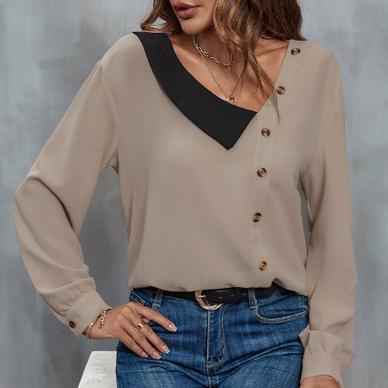Damebluse med asymmetrisk krave og dekorative knapdetaljer Stilla