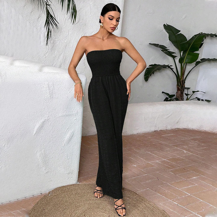 Kvinders afslappede jumpsuit med off-shoulder design og elastisk top Stilla
