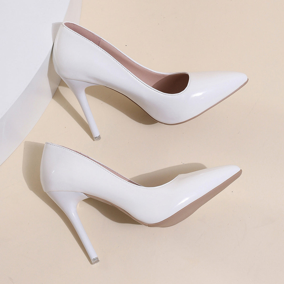 Dame pumps med stilfuldt spidsdesign og glinsende lakoverflade Stilla
