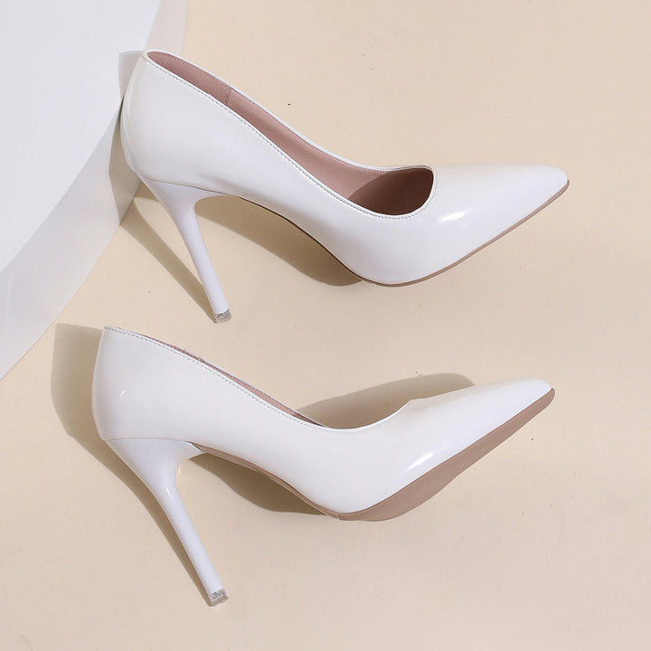Dame pumps med stilfuldt spidsdesign og glinsende lakoverflade Stilla