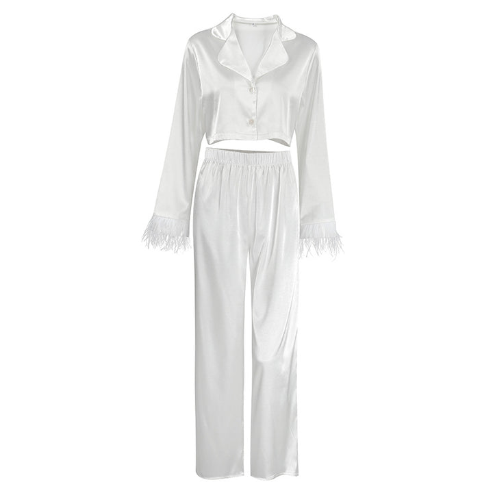 Dame Elegant cropped top og løstsiddende bukser med fjerdetaljer Stilla