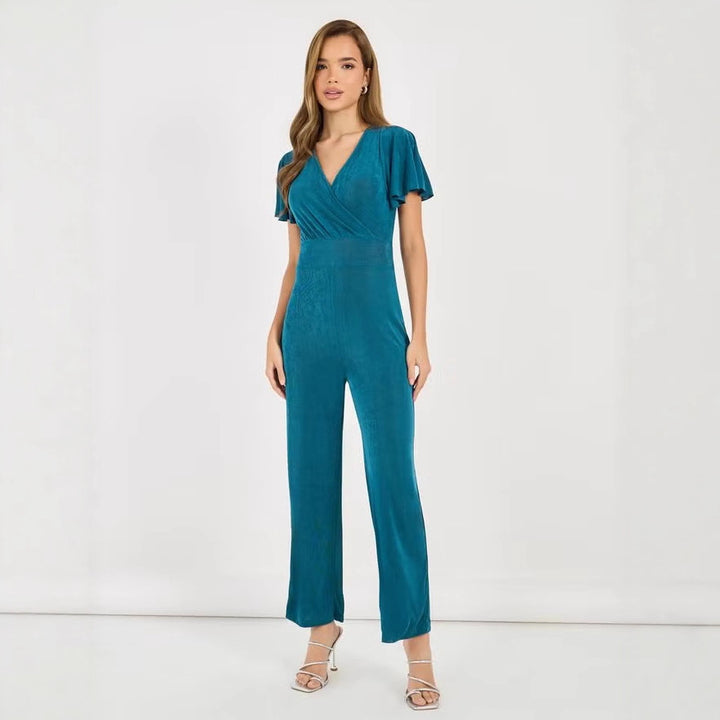 Dame elegant jumpsuit med flydende snit og detaljerede puffærmer Skovae