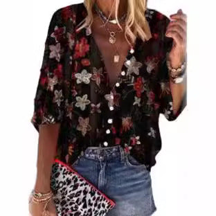 Damebluse i transparent spids med blomsterapplikationer og knapliste Stilla